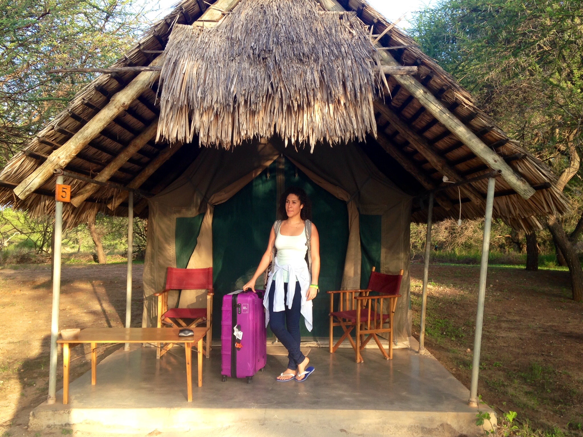 Woman in front of a lodgetent